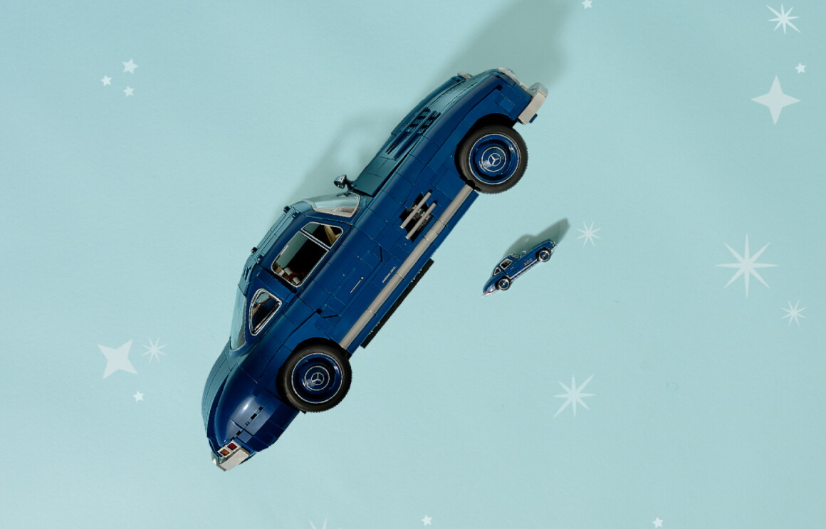 Hotwheels blue car toy floating in starry sky with miniature version