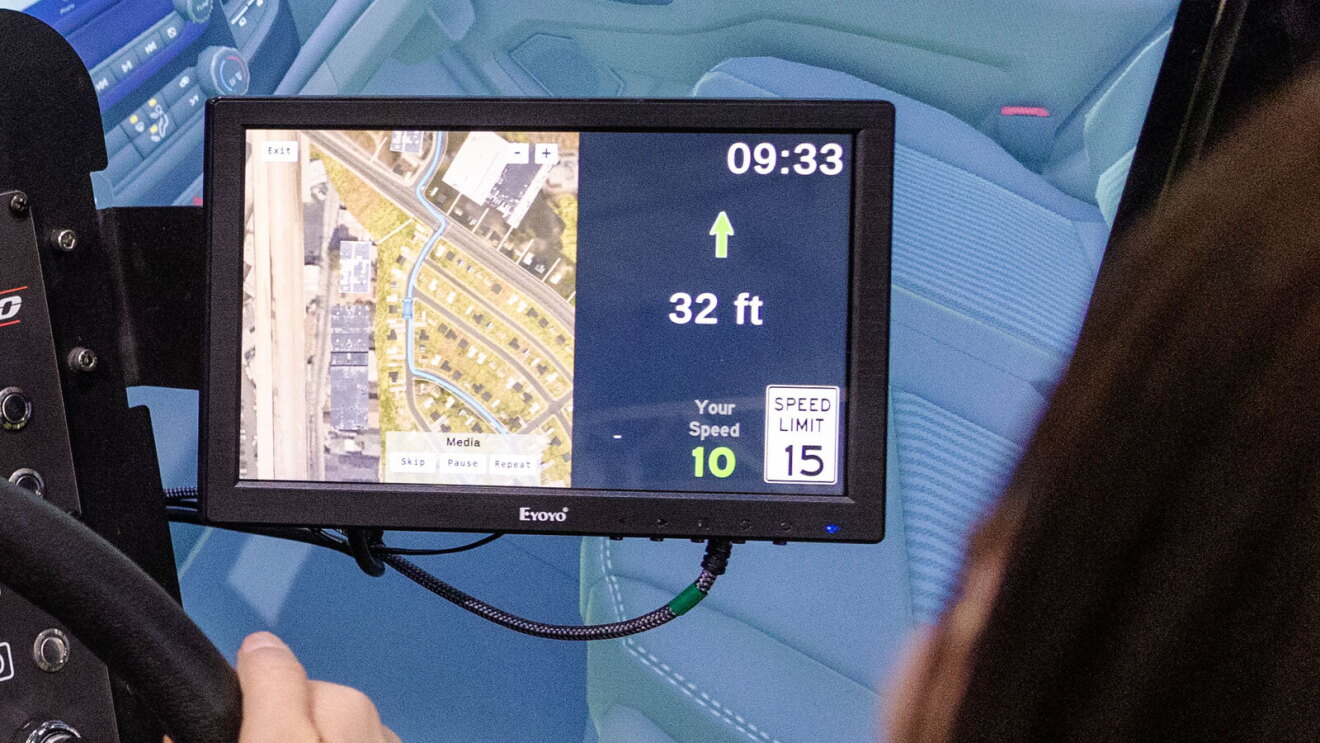 An image of a small screen with a map and several metrics on it, including a speed limit sign that says the speed limit is 15 miles per hour.