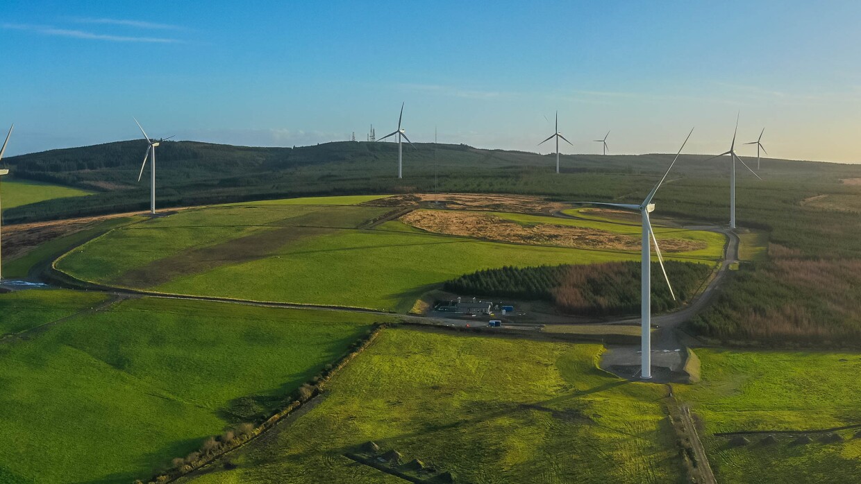 wind farm and green hills