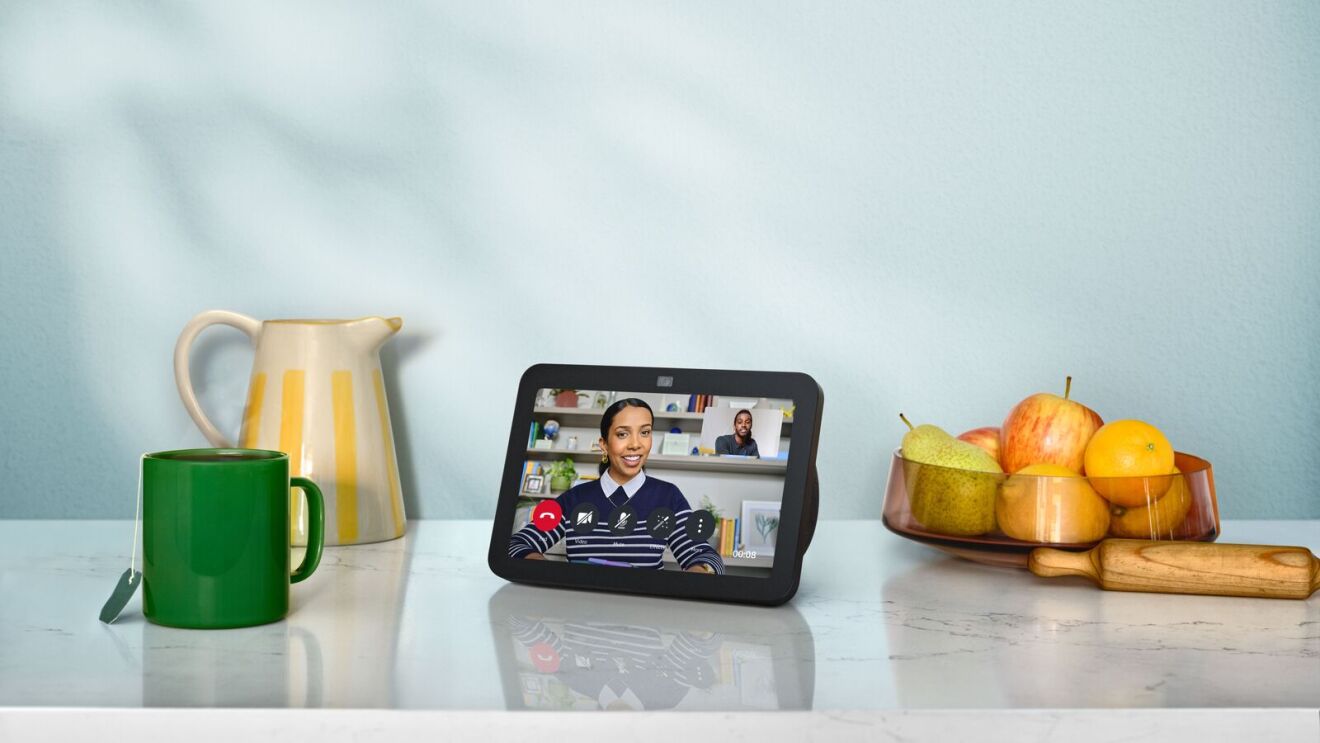 Echo Show displaying video call next to kitchenware and fruit