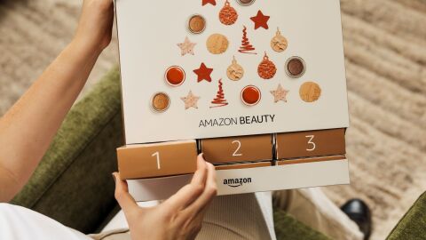 Person pulling out the first box from the 2025 Amazon beauty advent calendar