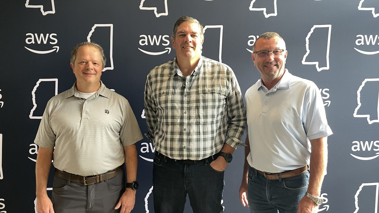 Colleagues posing at AWS event or office