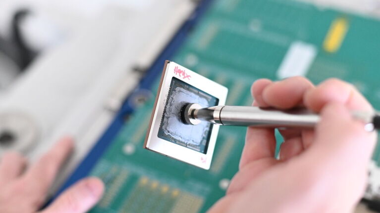 A photo of an AWS Trainium chip.