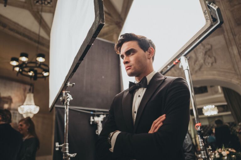Stylish man in tuxedo at elegant event venue