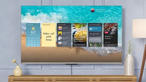 An image of a Fire TV mounted to a wall in a living room.