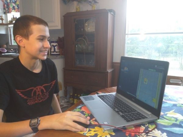 Amazon Future Engineer student learning computer science skills from home.