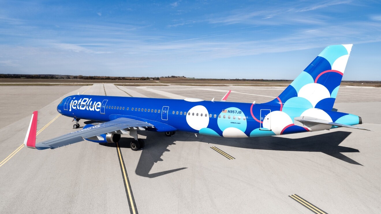 Modern JetBlue airliner with playful bubble motif exterior