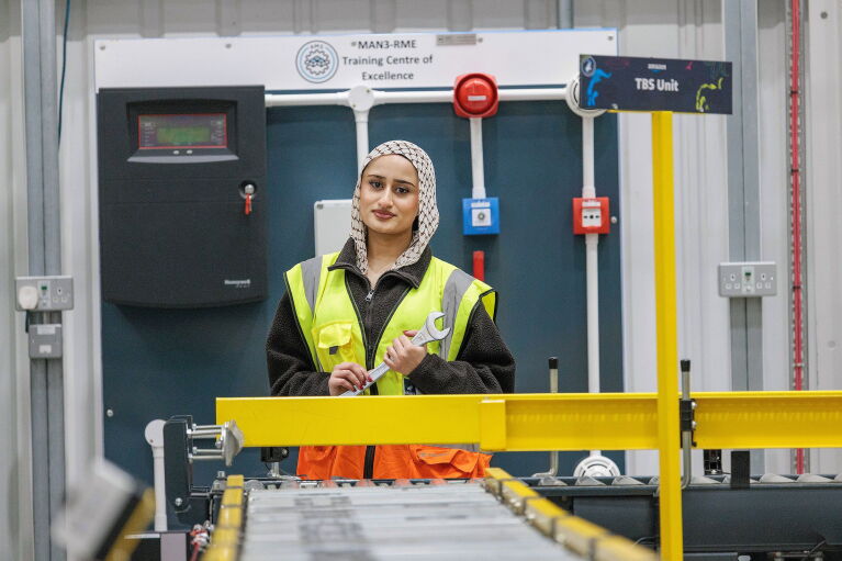A girl standing by a trolley