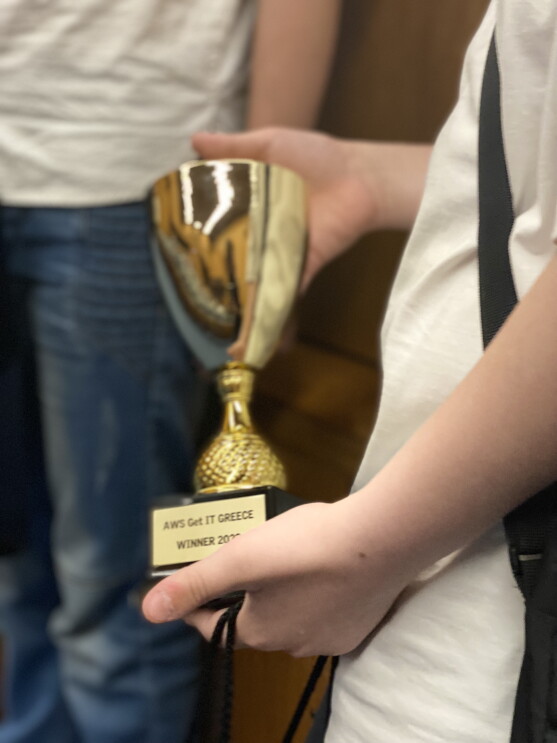 Close up image of AWS GetIT Greece award winner holding winning trophy