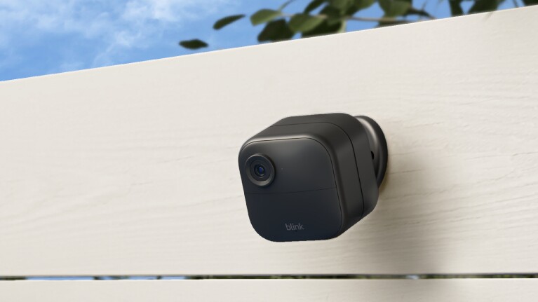 An image of a Blink Outdoor 4 camera mounted on a wall. 