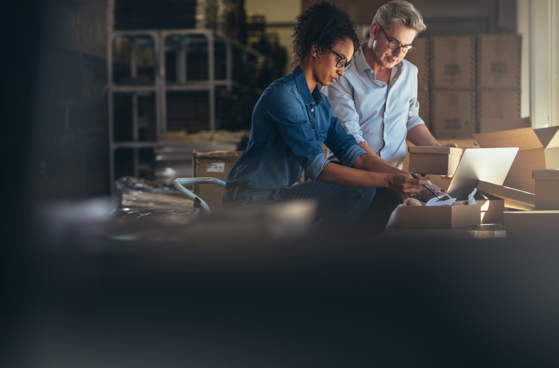 Online store business partners working together in a small office - illustration of SME selling on Amazon