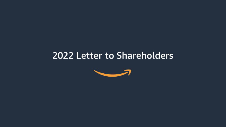Squid ink color graphic with text that reads: "2022 Letter to Shareholders" with an orange Amazon smile logo underneath. 