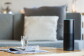 A black Amazon Echo sits on a table. 