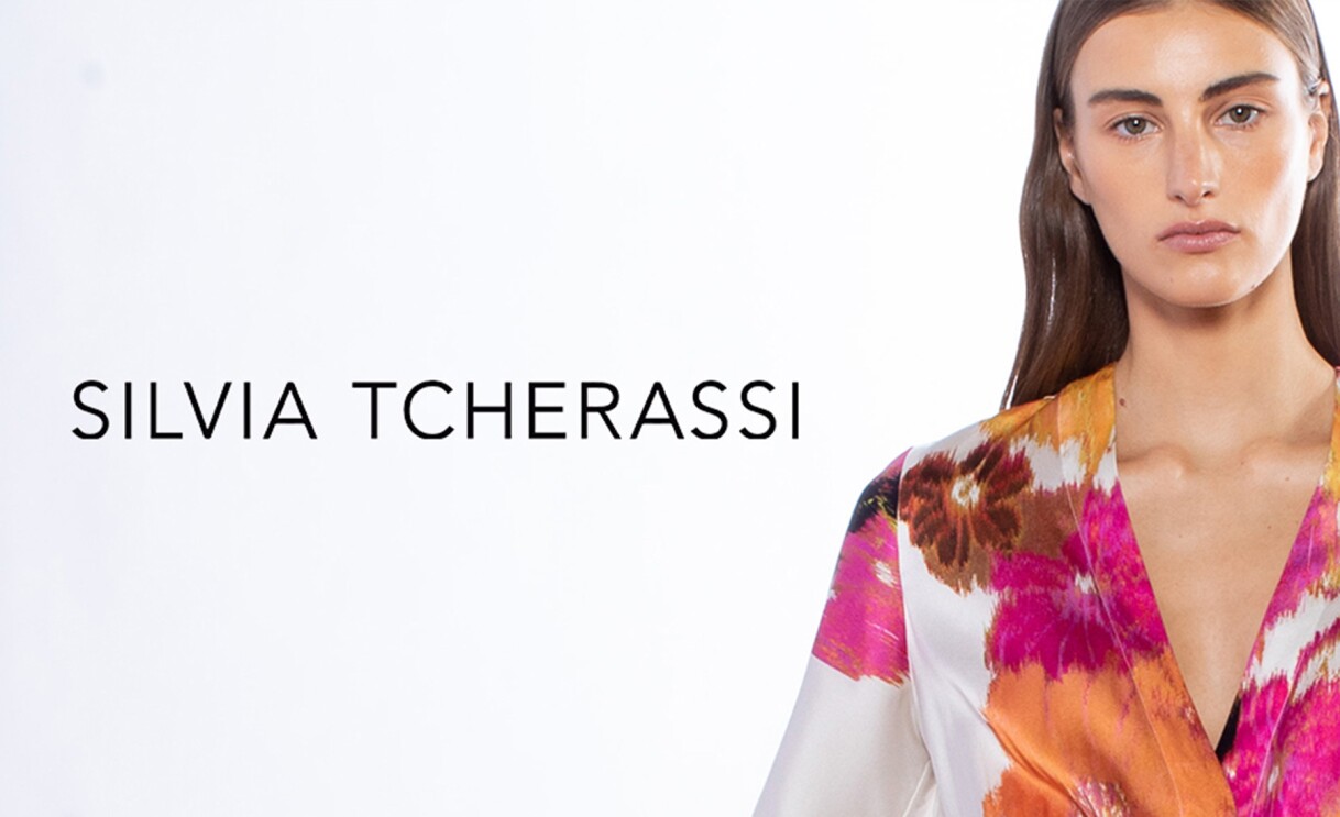 An image of a model wearing a floral piece and text that reads "Silvia Tcherassi."