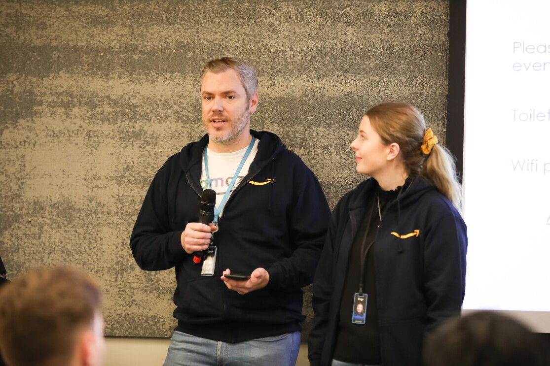 Gareth Johnson and Paige from glamazon giving a speech at the LGBT+ Leaders in STEM event.