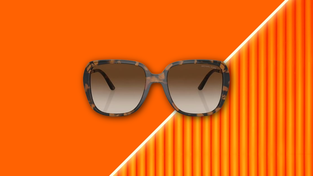 Michael Kors sunglasses floating against vibrant orange background.
