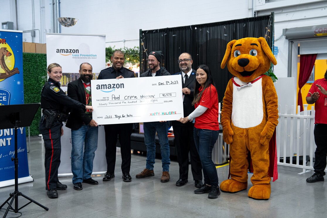 Amazon Staff presenting donations to Peel Region Crime Stoppers and The Salvation Army