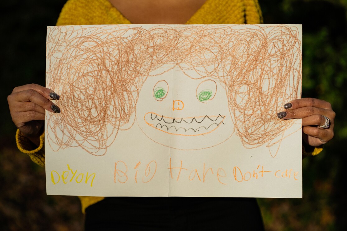 Self portraits of students shared with Crystal Swain-Bates after she participated in a book reading at a school.