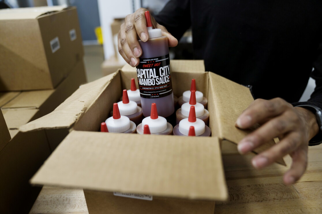 Capital City Mambo Sauce is being boxed up in bulk to be shipped out.