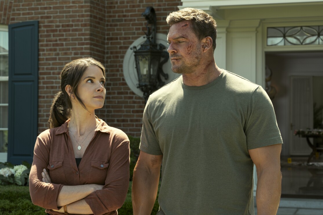 Jack Reacher (left) and Susan Duffy (right) looking at each other in "Reacher" season 3.