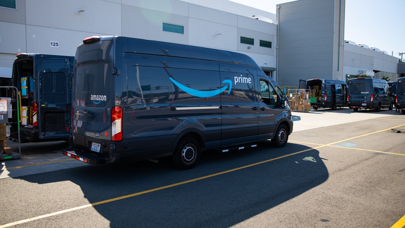 Amazon vans lined up and ready to gather and deliver customer orders