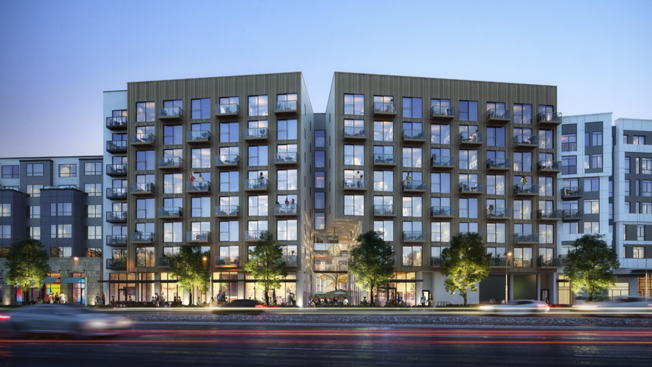 The outside of Atrium Court. There is a road and car in front of the building.