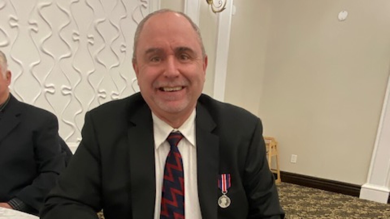 Michael wearing medal