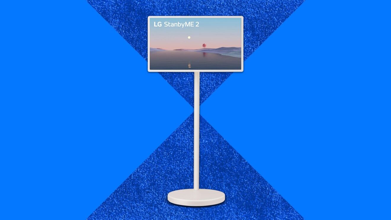 LG StanbyME 2 display on stand with desert sunset screensaver
