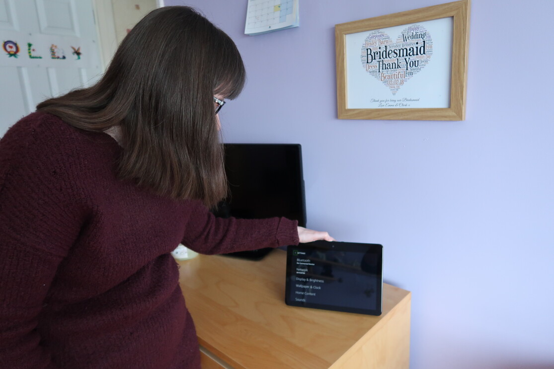 Holly Tuke’s stood next to device in own home 