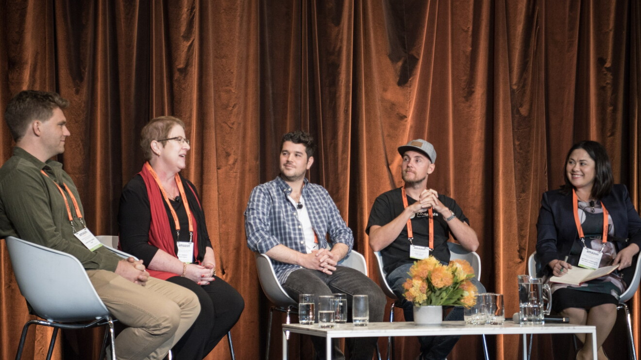 A group of sellers onstage at the Amazon Seller Summit.