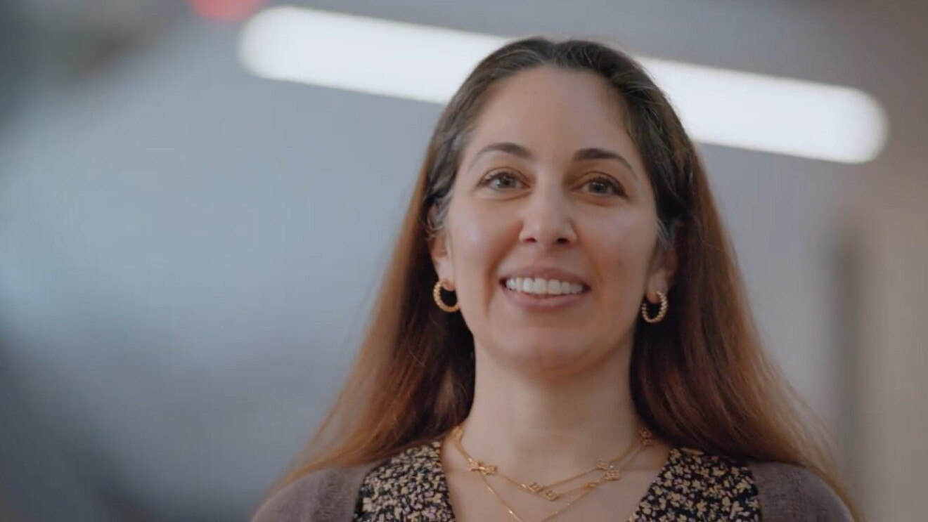 A woman smiling.