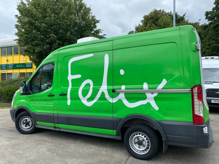 A green van with the Felix Project logo 