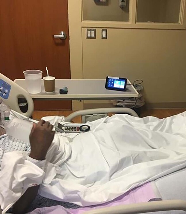 A child in a hospital bed engages with an Echo Show devices.