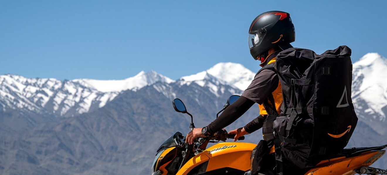A Delivery Associate makes a delivery at Leh