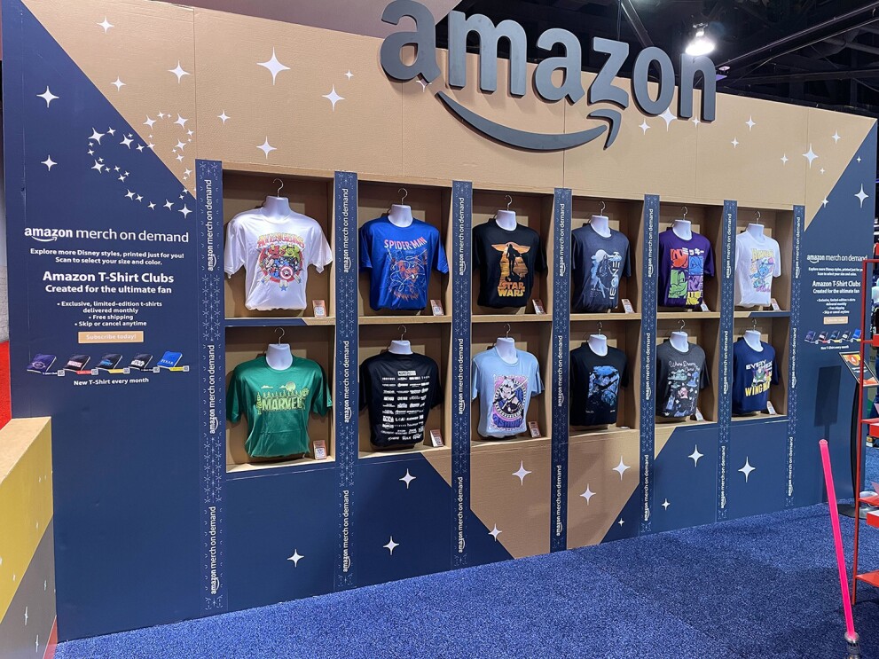 An image of two rows of shirts at Amazon's booth at the D23 expo