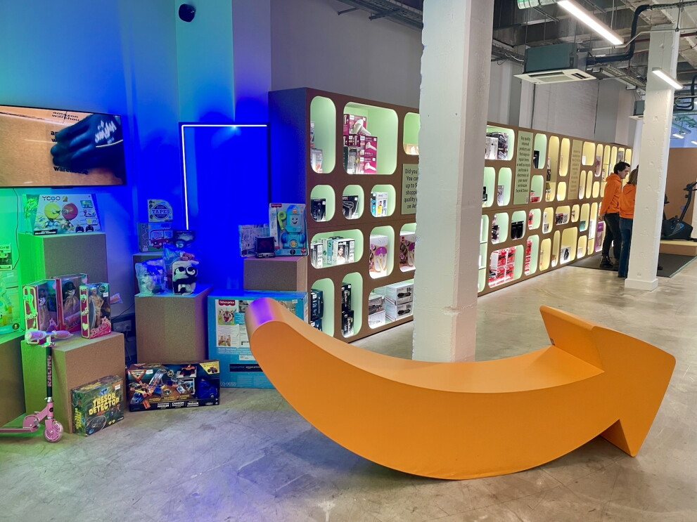 A structure of the Amazon Smile Logo in the entrance of the Amazon Second Chance store 