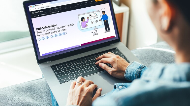 AWS Skill Builder platform shown on computer, offering AI and cloud training