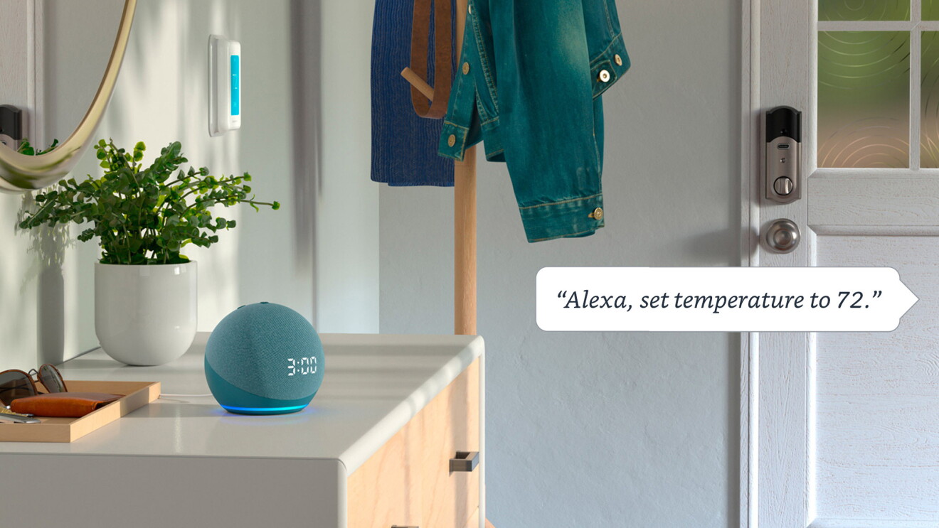 An image of a blue Echo device sitting on the counter by the house door. The device shows "3:00" time and there is a textbox to the right that reads "Alexa, set temperature to 72."