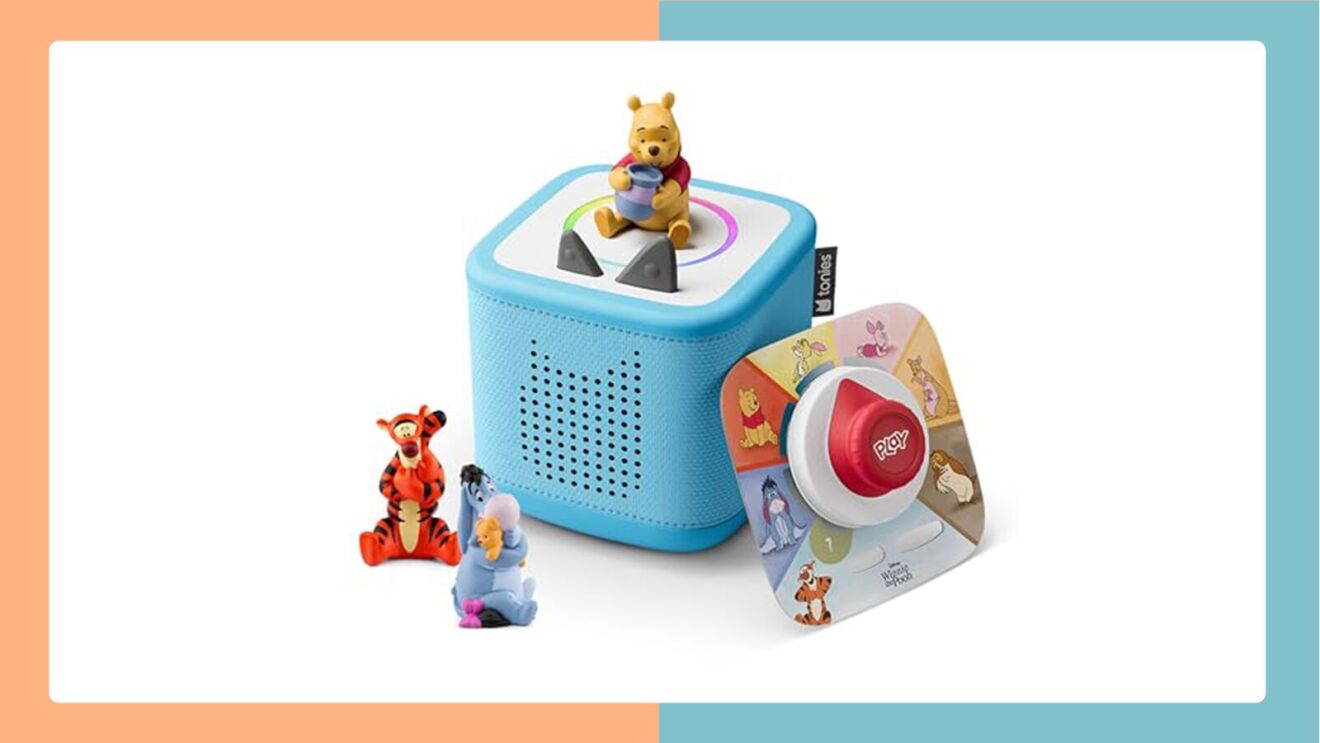Winnie the Pooh figurine atop blue Toniebox speaker with Tigger and Eeyore toys nearby