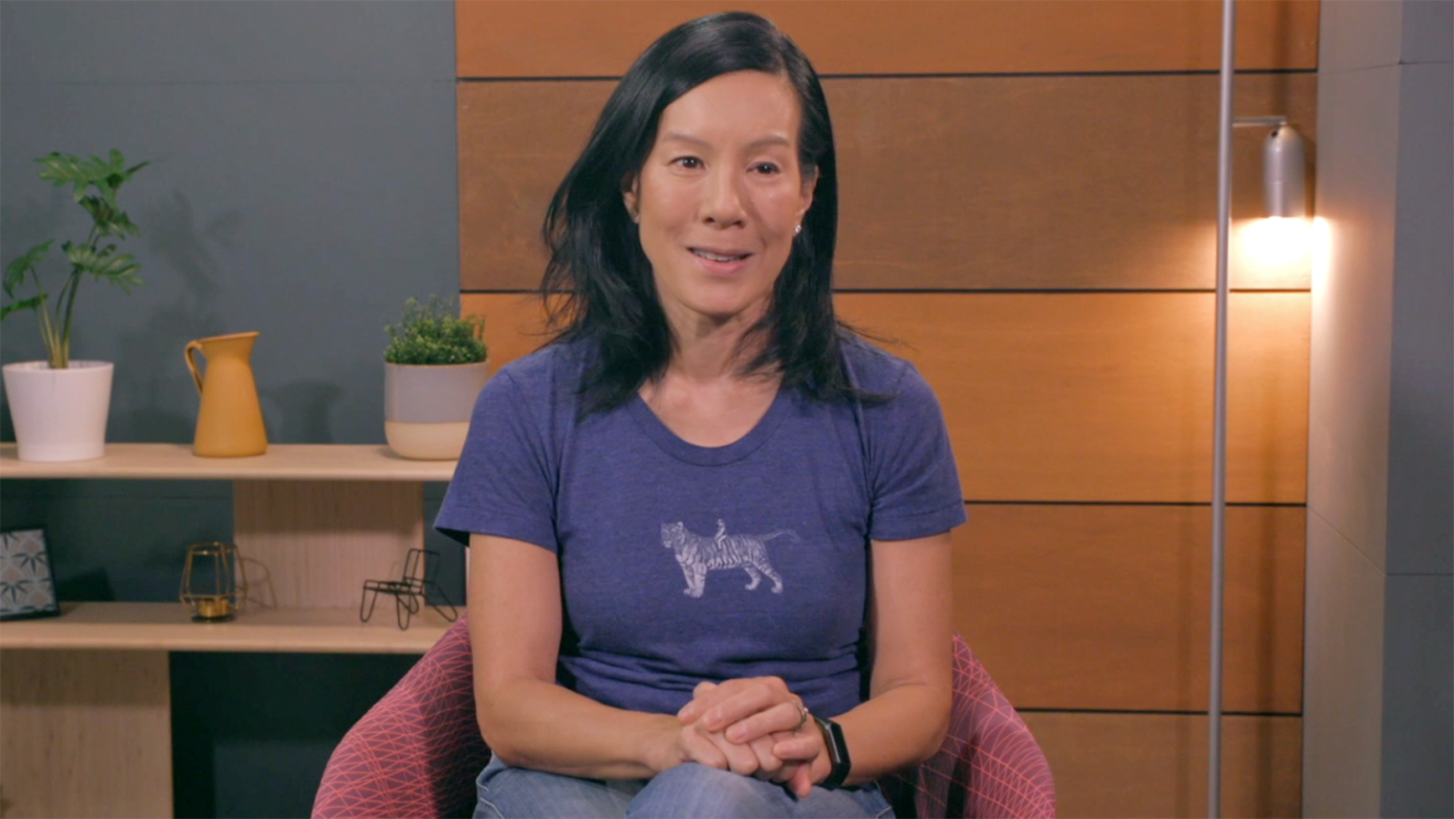 A photo of Founder of Cowboy Ventures, Aileen Lee, sitting in a chair