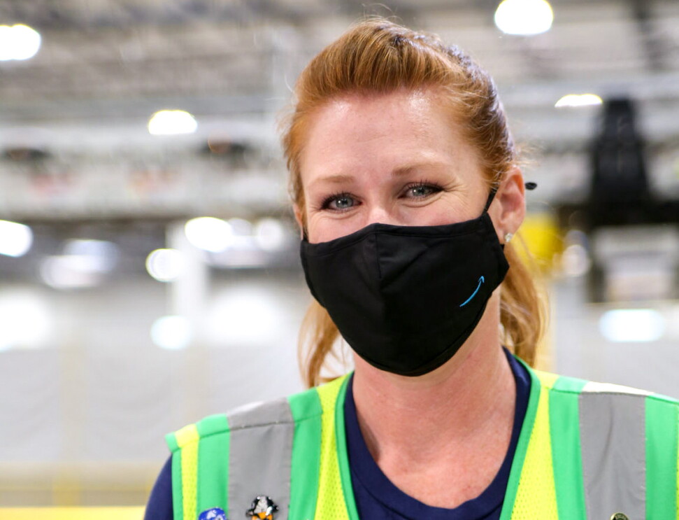 An image of an Amazon employee in a fulfillment center demonstrating how WorkingWell works.