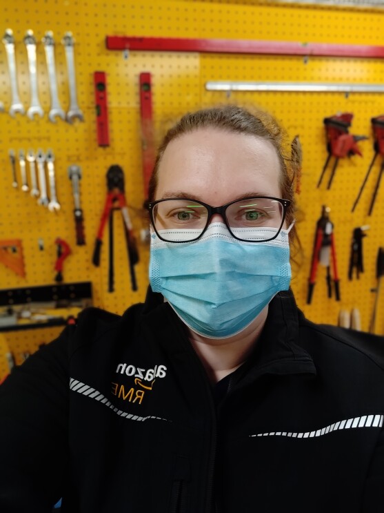Amazon employee wearing a mask