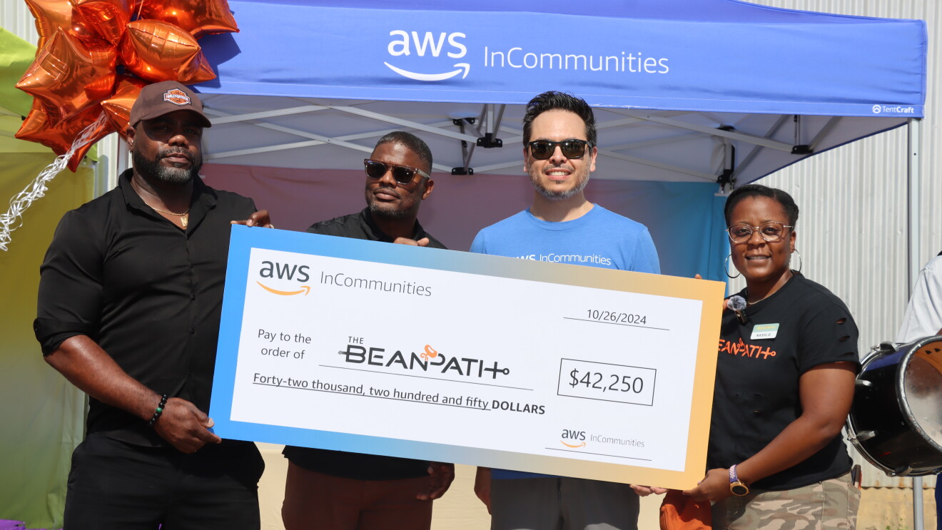 Bean Path's 6th Annual Block Party: four individuals holding up a check 