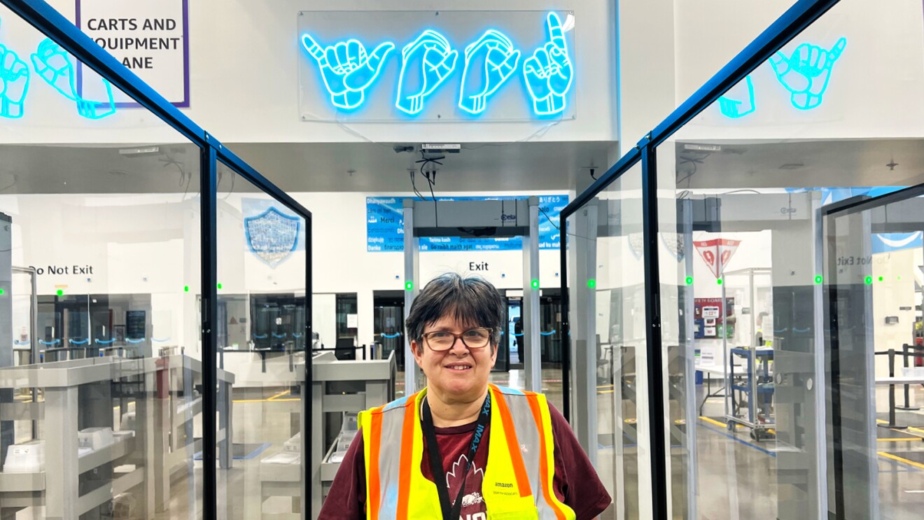 A black and white image of an Amazon employee.  