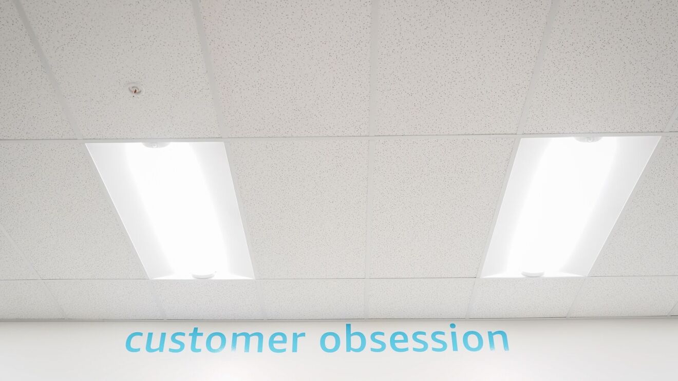 wall with "customer obsession" written out