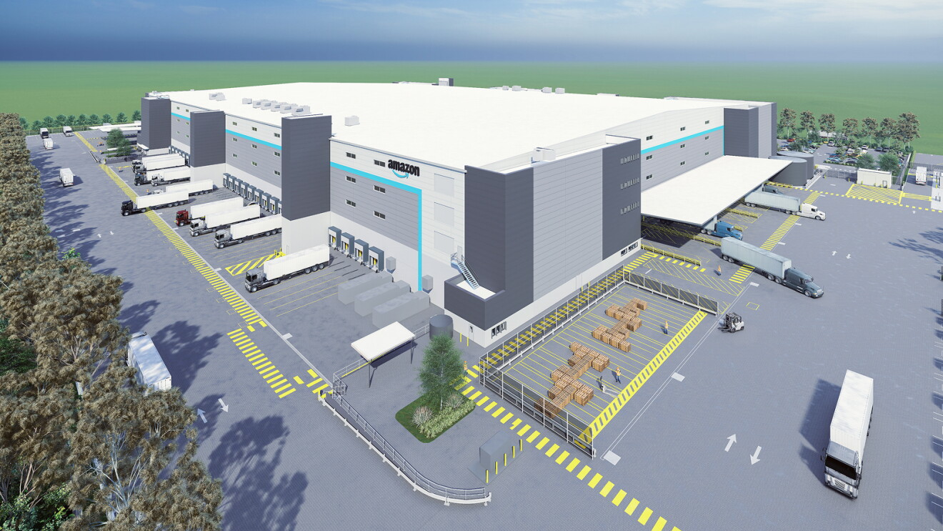 Large Amazon fulfillment center with multiple loading docks and truck bays