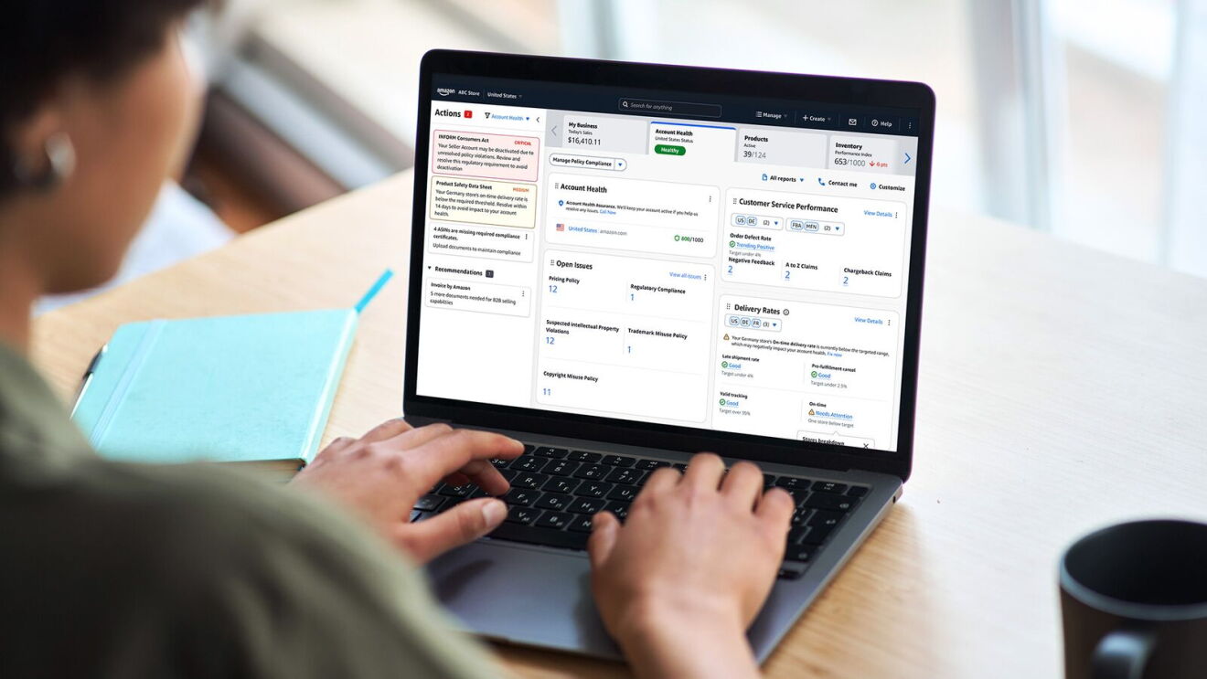 Person reviewing Amazon seller dashboard with account health metrics on laptop