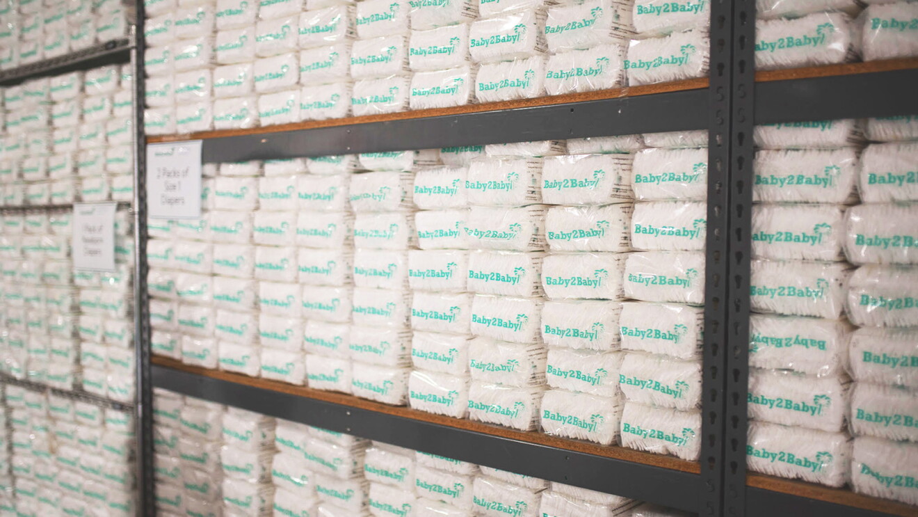 A photo of diapers packaged by Baby2Baby on a shelf.