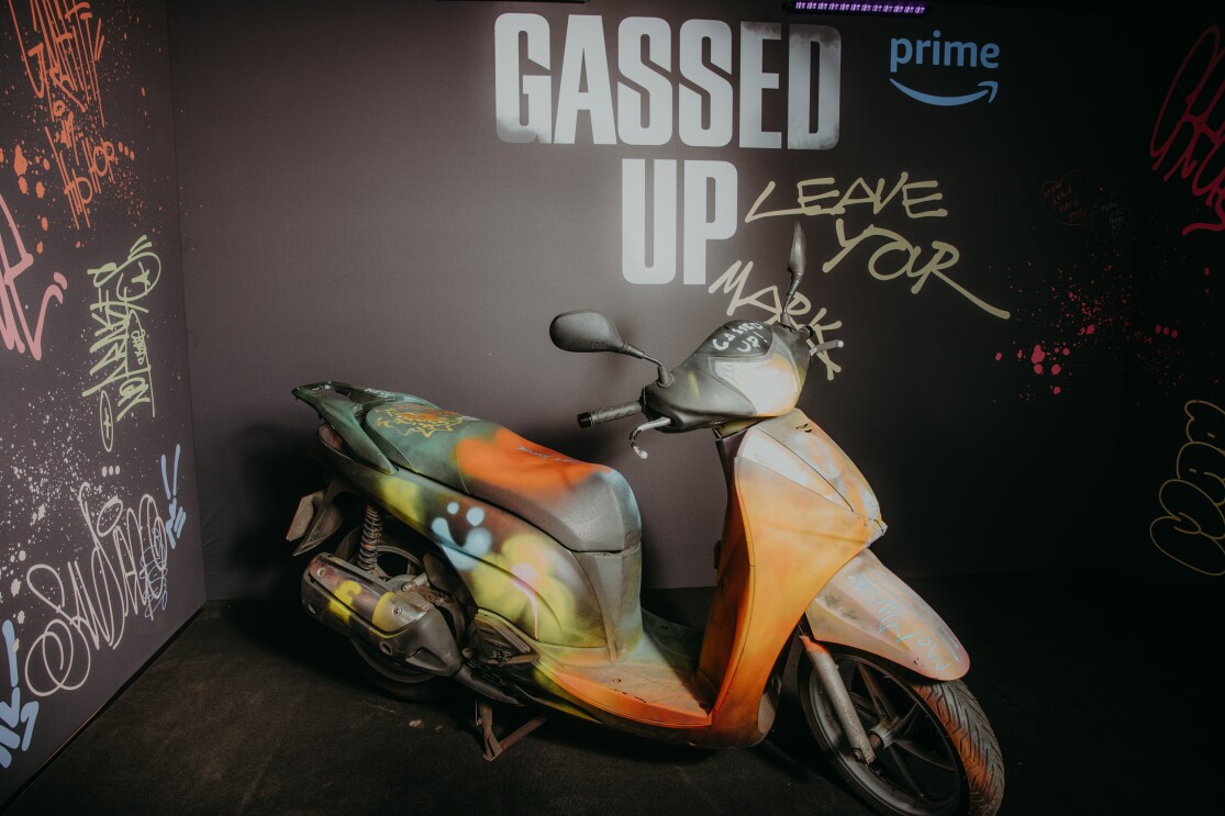 An immersive UV photo room with a motorcycle in the middle