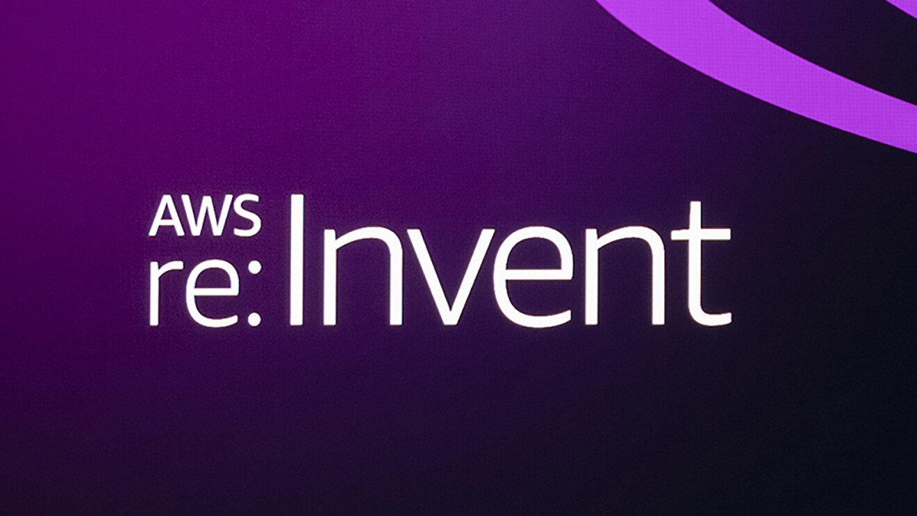 AWS re:invent logo on a purple gradiant background. To the right of the logo, streams of aqua and purple move appear to move fluidly across the image.